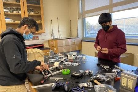 Arnav and Ashish prototyping a launcher.